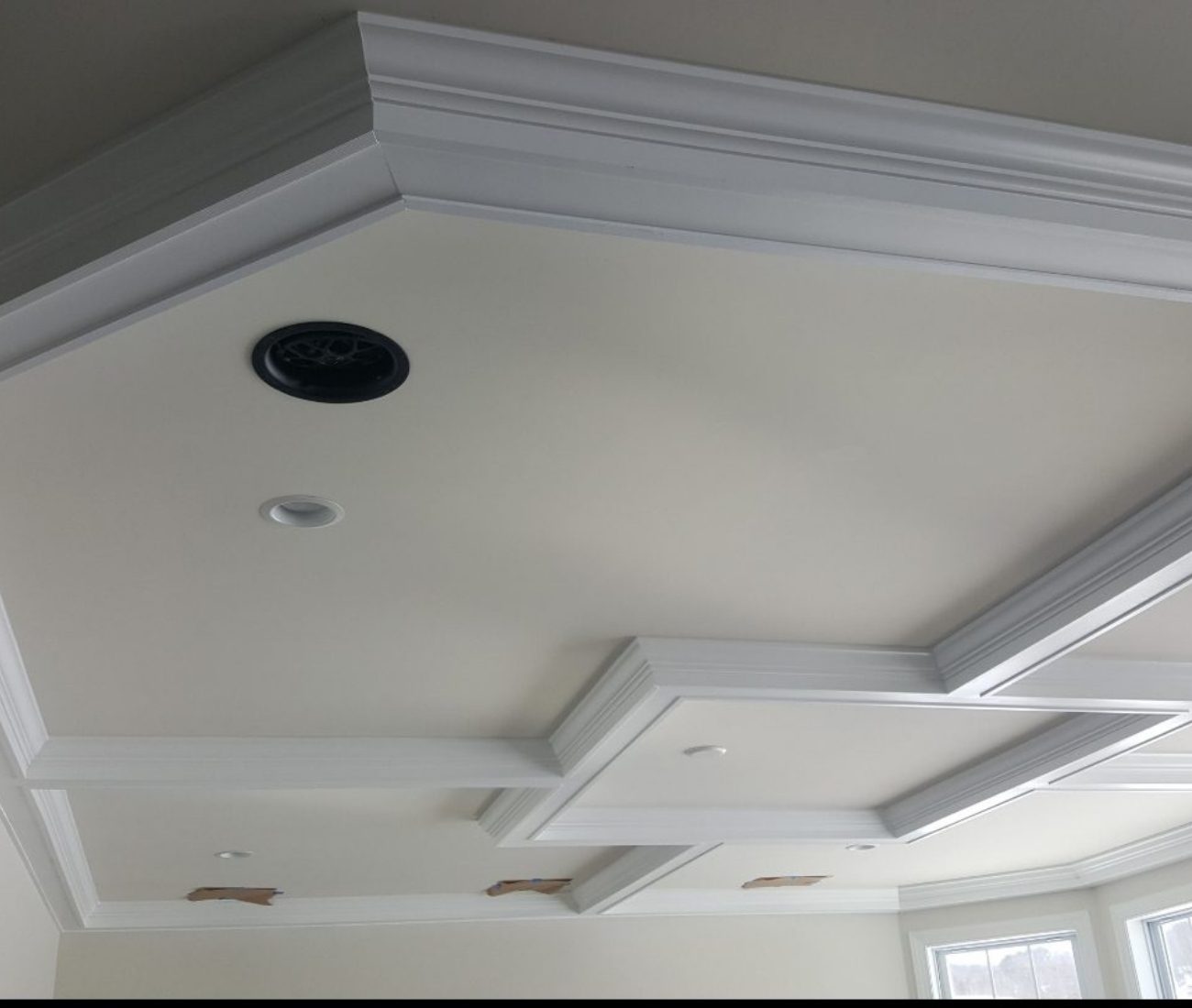 Ceiling Trimi Home Berlin Detailed coffered ceiling trim installation with recessed lighting in progress, showcasing clean white crown molding and precise craftsmanship — completed by Central Connecticut Building & Remodeling in Berlin, CT.